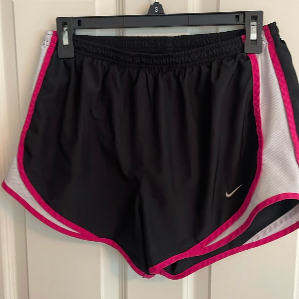 Black with pink accents Nike shorts. Size M